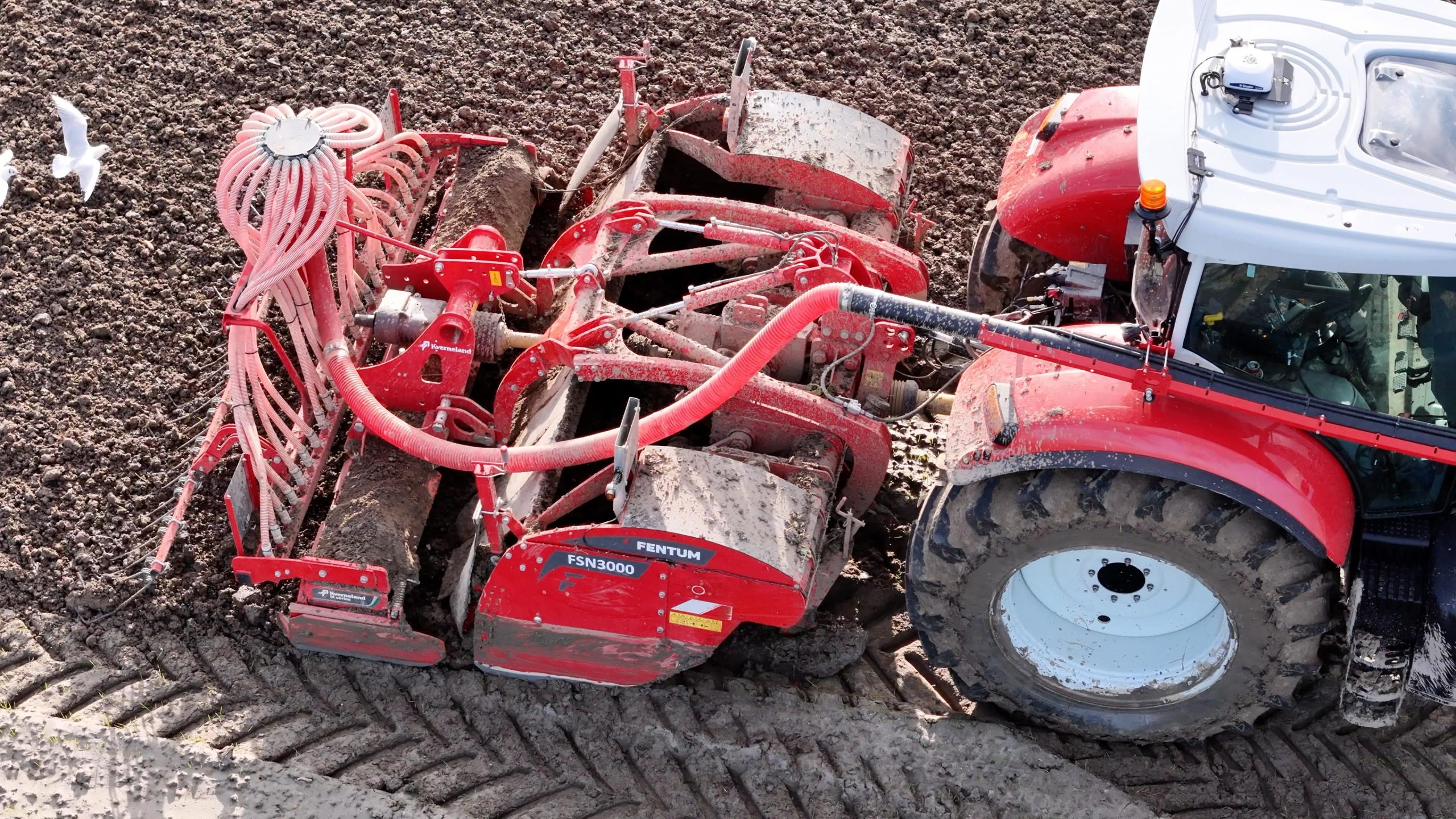 Spitmachine in actie